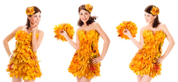 秋美模特身穿黄色枫叶裙，裹着孤白。快乐微笑的年轻女子与枫叶花束。秋季时尚图片下载