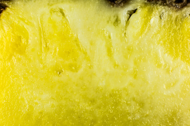 菠萝纹理背景。异域水果特写照片，宏观视图。健康的生活方式的食物。漂亮的壁纸。素食者和纯素食概念。维生素来自大自然。图片下载