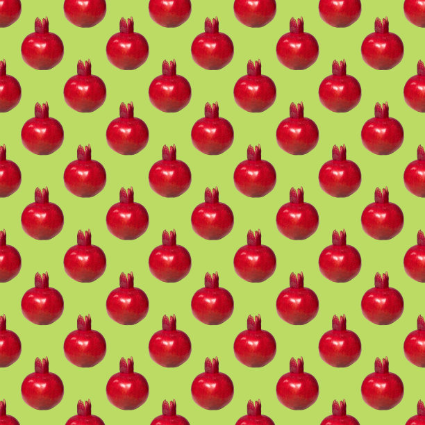 绿色背景上的成熟红石榴图案，创意食品概念，扁平图片下载