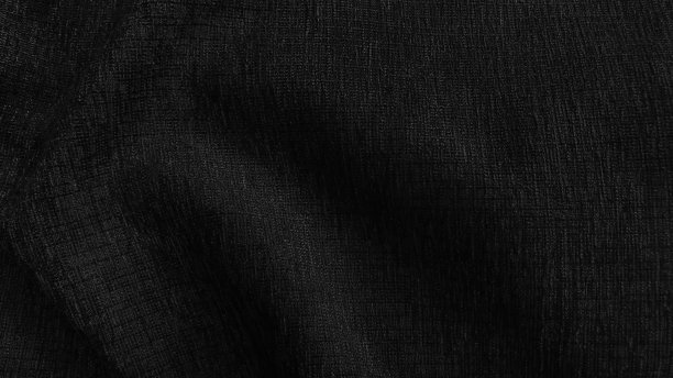 紧致豪华典雅的波浪和折叠丝绸面料纹理在黑色色调。抽象的面料背景和空白的设计空间。图片下载