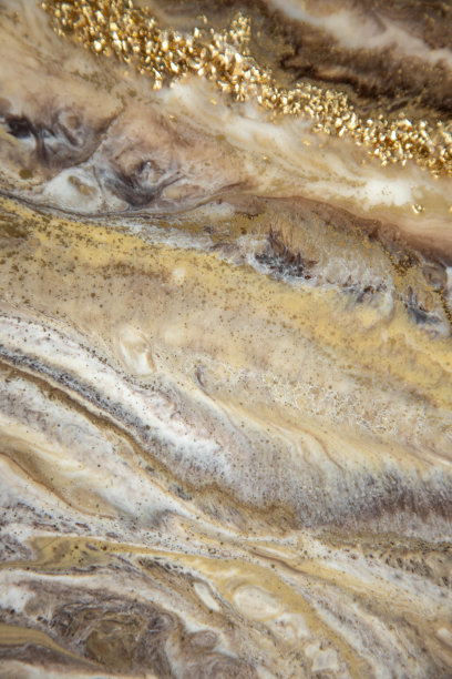 环氧树脂抽象画。大理石条纹的金色，棕色和米色。抽象现代与条纹液体背景的设计。图片下载