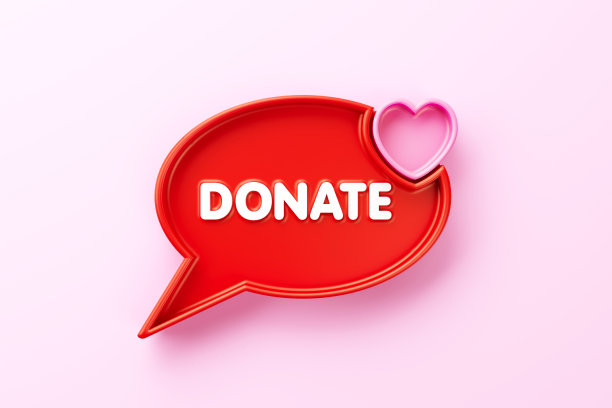 捐赠手写的红色演讲气泡与心形坐在粉红色的背景图片下载