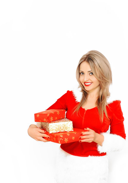 美丽的圣诞老人女人穿着裙子，拿着礼物在白色的背景上摆姿势。圣诞节的概念。图片下载