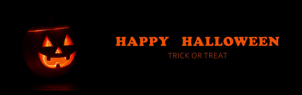 黑色背景上发光的万圣节南瓜，上面写着“万圣节快乐”。“不给糖就捣蛋”。横幅。图片下载