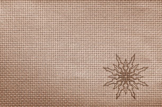 时尚的圣诞背景。织物纹理上有雪花。图片下载