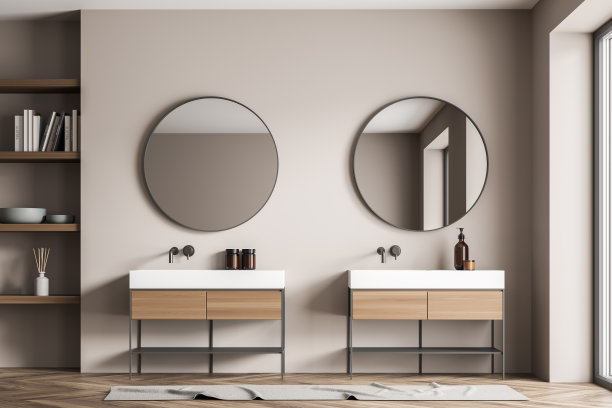 浴室的墙上有两面圆镜，上方有两个梳妆台图片下载