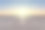 空旷的停车场映衬着贫瘠的土地和美丽的日落天空。图片下载