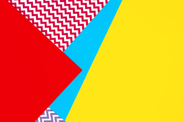 抽象几何时尚纸纹理背景在黄色，红色，粉红色，蓝色的颜色。俯视图，平躺图片下载