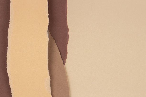 撕裂垃圾撕裂米色棕色几何纸背景。彩色撕纸拼贴墙纸图片下载