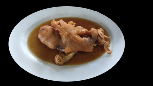 红烧猪蹄，中国菜。黑色背景。图片下载