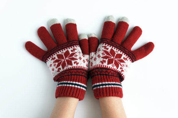 孩子们戴着手套的手在白色背景下过圣诞节图片下载