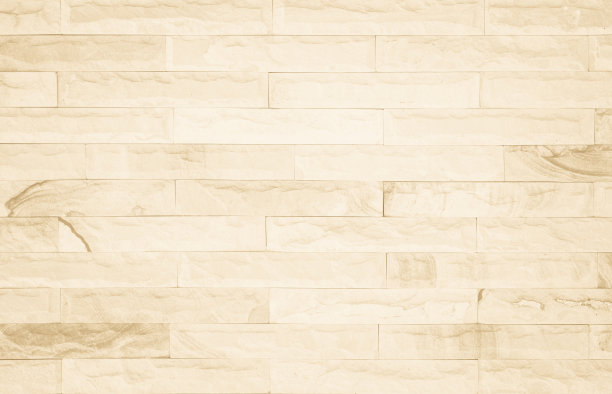 空背景的宽奶油色砖墙纹理。米色老褐色砖墙混凝土或石材纹理，墙纸石灰石抽象地板/网格不均匀的内部岩石。家居装饰设计背景。图片下载