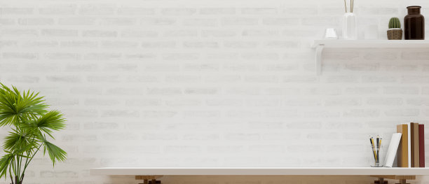 在白色砖墙上方的现代工作台上复制蒙太奇空间。图片下载