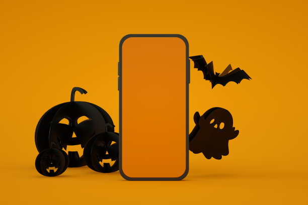 移动智能手机屏幕与万圣节橘色背景图片下载