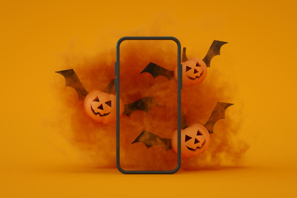 移动智能手机屏幕与万圣节橘色背景图片下载