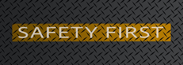 金属纹理上的警告条上的安全第一标志图片下载