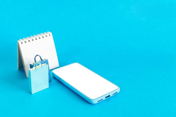 店铺店智能手机、购物袋和促销日历图片下载