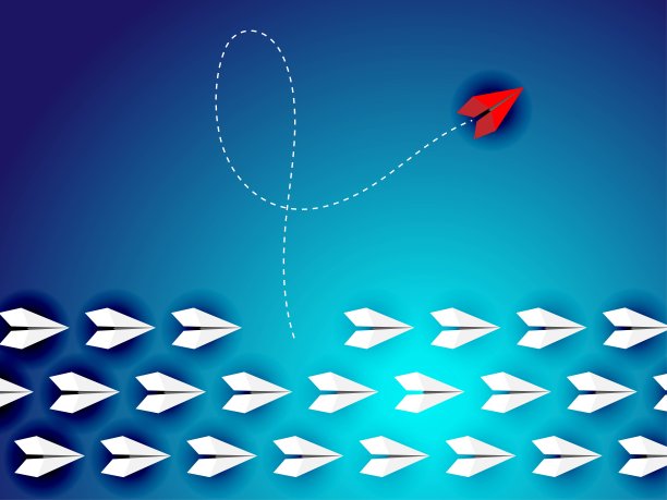 一组纸平面在一个方向，其中一个指向不同的方向。图片下载