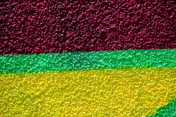 极简主义的纹理背景，喷绘墙像涂鸦艺术，与生动的深红色，黄色和绿色的颜色图片下载