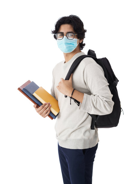 大学生穿着mas，拿着书和背包图片下载