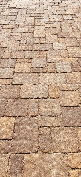 透视新石、卵石、石块、铺路、街道、小路、人行道、车道等垂直建筑背景图片下载