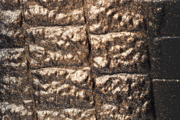 铜石纹理。暗背景设计。图片下载