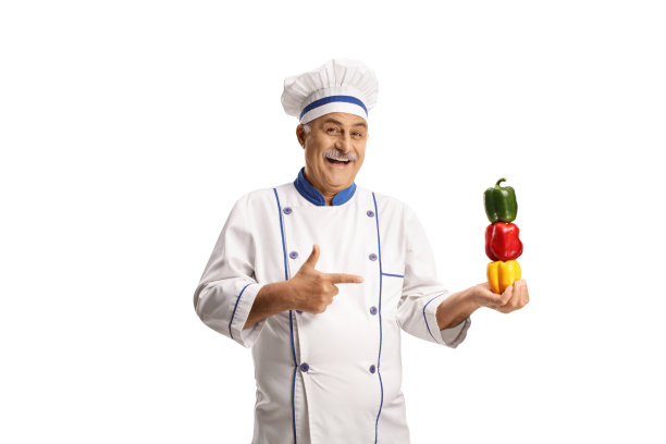 面带微笑的快乐年长男厨师拿着甜椒图片下载