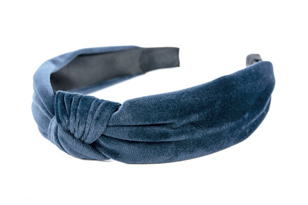 丝绒头带结设计孤立在白色背景。蓝色丝绒织物发带系孤立图片下载