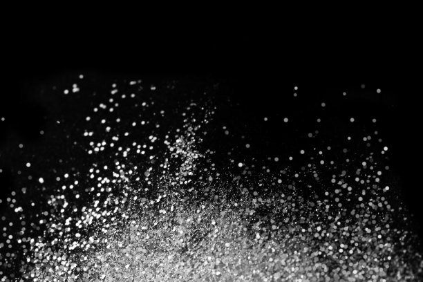 亮片照亮抽象的背景。图片下载