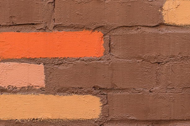 棕色的砖墙用一些彩色的砖图片下载