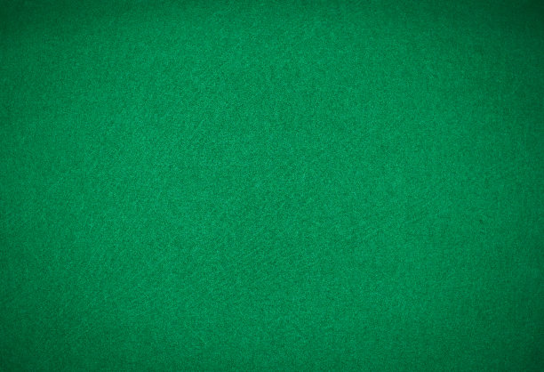 赌桌上的绿色桌布。绿色背景。图片下载