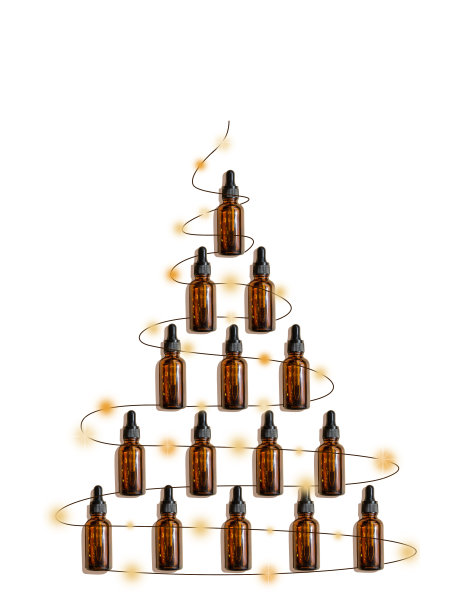 优雅的圣诞树花环玻璃滴管瓶的实物模型在白色孤立的背景。美容行业创意圣诞树的概念图片下载
