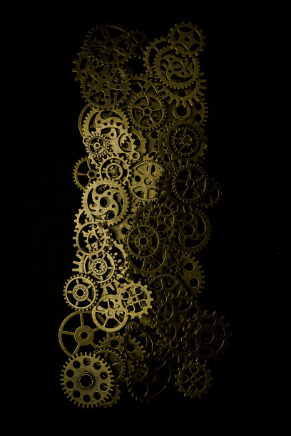 齿轮和手表在黑色背景金属车轮图片下载