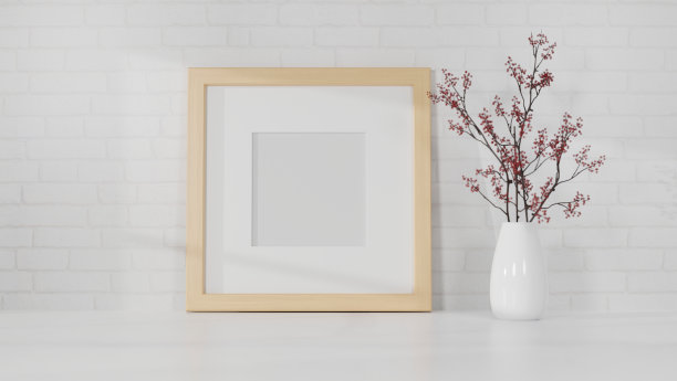 在白色的桌子上画一个简单的木制照片海报框架，白色的墙壁上画一个花瓶。图片下载