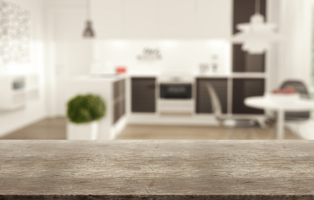 模糊的厨房背景和质朴的棕色复古木桌。图片下载