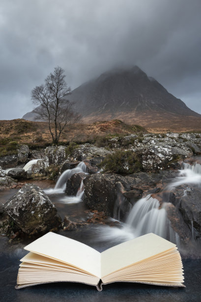 冬日早晨，苏格兰高地Buachaille Etive Mor瀑布的史诗景观图像从阅读书的书页中浮现出来图片下载