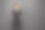 小女孩穿着黑色t恤与空间为您的标志或设计在工作室的灰色背景图片下载