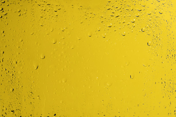 黄色背景与水滴。图片下载