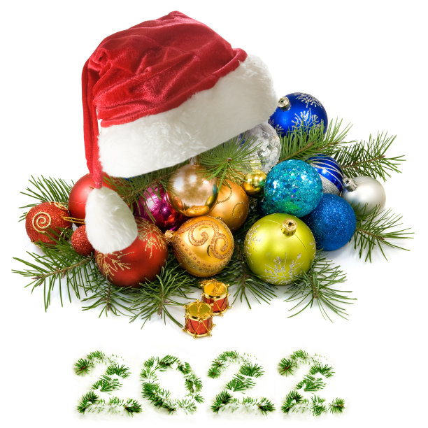 圣诞玩具和白色背景上的红色圣诞帽图片下载