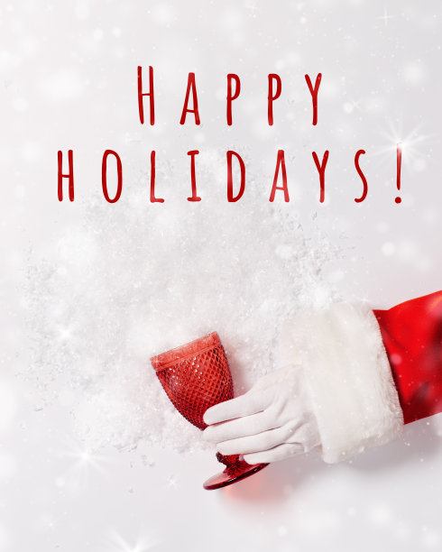 圣诞老人手捧玻璃，从红色的玻璃，从雪花散落，创意寒假，新年，圣诞晚会。喜庆饮料用的红色玻璃器皿图片下载