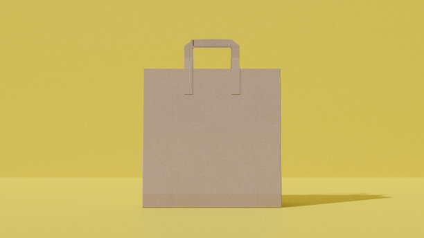 黄色背景上的购物袋模型。图片下载