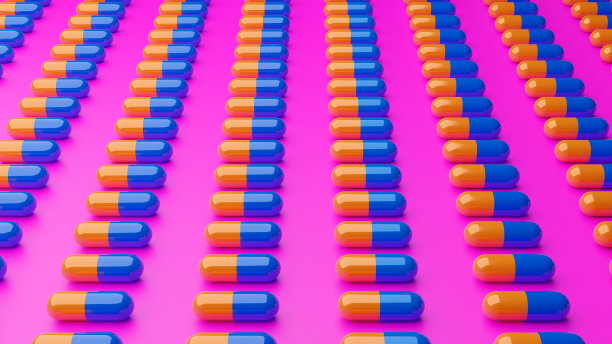 3d插图蓝色和黄色的3d药丸在粉红色的背景图片下载