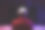 后视图年轻的播放器视频电脑pc。年轻人坐在游戏站的椅子上。Streamer男子戴着耳机在暗室里在线玩动作游戏。图片下载