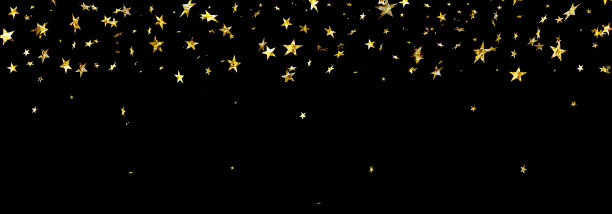 金色的星星飘落在黑色的背景上图片下载