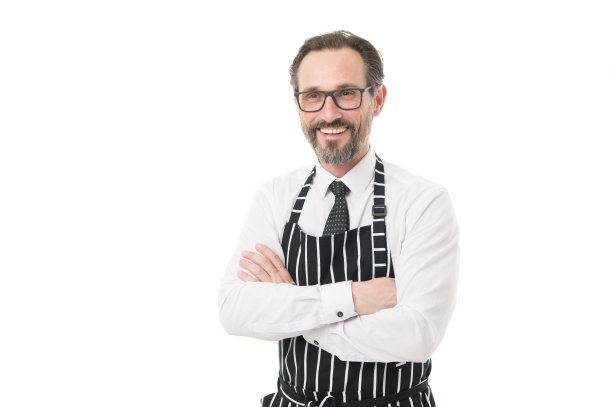 帮助丈夫的概念。准备好帮助。厨师、理发师或穿着围裙的小贩。穿围裙的大胡子推销员。家庭的主人。家乡菜。家庭职责。分享家庭责任图片下载