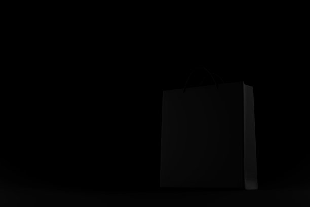 3d渲染黑色背景上的黑色购物袋。3d渲染黑色购物袋在黑暗图片下载