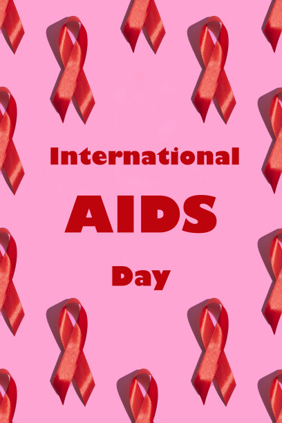 国际艾滋病日。在粉红色背景上有硬阴影的红丝带。艾滋病意识的概念。垂直的照片。模式一个铭文图片下载