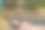 一辆破旧的摩托车停在灰色的柏油路上图片下载