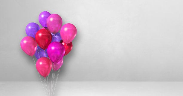 粉红色的气球束在白色的背景墙上。水平的旗帜。图片下载
