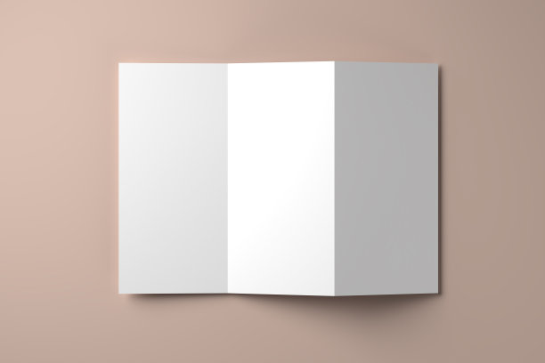 传单模型与手风琴折叠(之字形或leporello折叠)躺在米色的背景图片下载